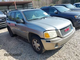 2003 GMC Envoy SLT with VIN 1GKDS13S932106295, listed as a IAAI auction lot 41594814 with 199,597 mi miles. Bid and sale history available at carsss.com. Image 1.