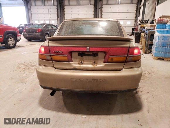 2002 Saturn LS z VIN 1G8JU54F62Y528998, wystawiony jako Copart lot #48390715 z przebiegiem 249 471 mil mil oraz Szkody całkowita. Historia ofert i sprzedaży dostępna na DreamBid. Obrazek 6.