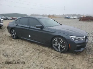 2019 BMW 7 Series 750i with VIN WBA7F0C54KGM25281, listed as a Copart auction lot 84741334 with 76,472 mi miles and Salvage Title. Bid and sale history available at carsss.com. Image 4.