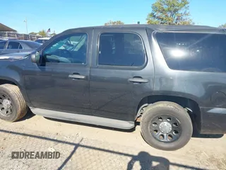 2013 Chevrolet Tahoe Commercial with VIN 1GNLC2E05DR266048, listed as a IAAI auction lot 40848505 with 95,459 mi miles and . Bid and sale history available at DreamBid. Image 14.