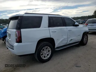 2015 GMC Yukon SLE with VIN 1GKS2AKCXFR744083, listed as a Copart auction lot 82003234 with 150,926 mi miles and Salvage Title. Bid and sale history available at carsss.com. Image 3.