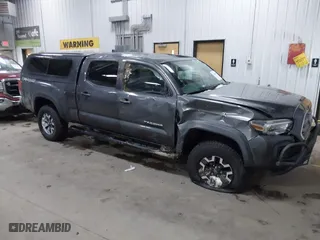 2016 Toyota Tacoma SR5 with VIN 3TMDZ5BNXGM009423, listed as a IAAI auction lot 41008068 with 107,426 mi miles. Bid and sale history available at carsss.com. Image 1.