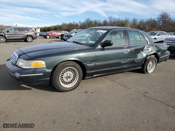 1999 Ford Crown Victoria LX with VIN 2FAFP74W7XX214966, listed as a Copart auction lot 80337724 with 134,624 mi miles and Salvage Title. Bid and sale history available at carsss.com. Image 1.