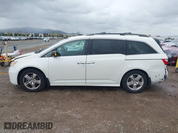 2013 Honda Odyssey Touring with VIN 5FNRL5H99DB041328, listed as a IAAI auction lot 41797520 with 148,523 mi miles and . Bid and sale history available at carsss.com. Image 14.