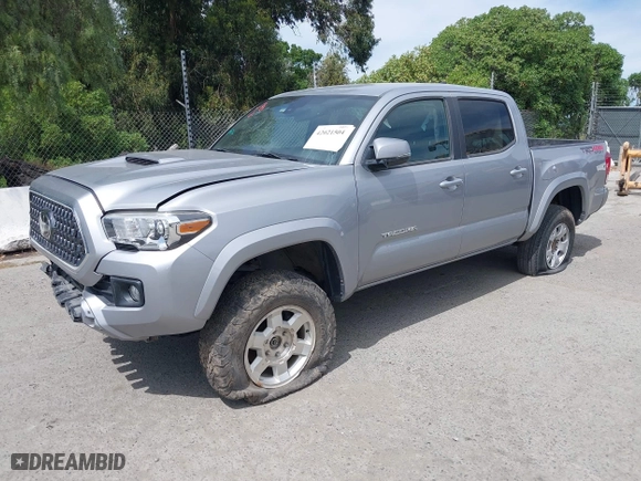 2019 Toyota Tacoma 4WD SR with VIN 3TMCZ5AN4KM194526, listed as a IAAI auction lot 42021504 with 87,767 mi miles. Bid and sale history available at carsss.com. Image 17.