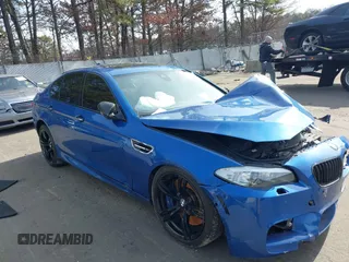 2013 BMW M5 with VIN WBSFV9C50DC773894, listed as a IAAI auction lot 41605598 with 99,803 mi miles. Bid and sale history available at carsss.com. Image 1.