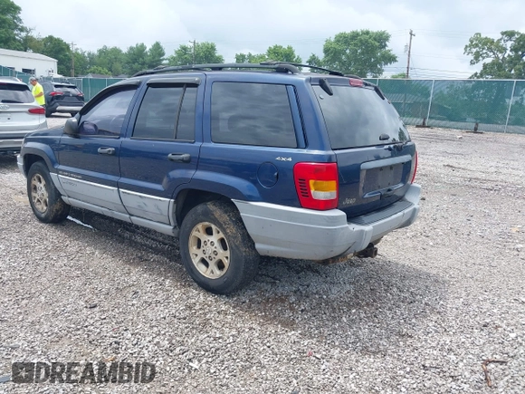 2000 Jeep Grand Cherokee Laredo z VIN 1J4GW48S9YC338947, wystawiony jako IAAI lot #42545830 z przebiegiem 234 251 mil mil oraz . Historia ofert i sprzedaży dostępna na DreamBid. Obrazek 3.