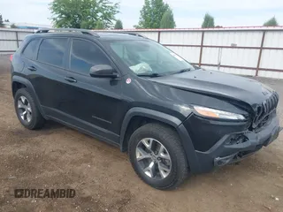 2016 Jeep Cherokee Trailhawk z VIN 1C4PJMBS4GW169267, wystawiony jako IAAI lot #42597291 z przebiegiem 79 258 mil mil oraz . Historia ofert i sprzedaży dostępna na DreamBid. Obrazek 1.