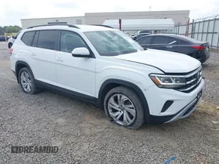 2021 Volkswagen Atlas SE z VIN 1V2WP2CA3MC527040, wystawiony jako IAAI lot #42082575 z przebiegiem 66 412 mil mil oraz . Historia ofert i sprzedaży dostępna na DreamBid. Obrazek 1.