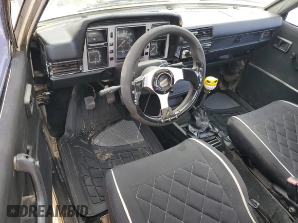 1982 Datsun 720 z VIN JN6MD06S6CW100827, wystawiony jako Copart lot #80042334 z przebiegiem 141 251 mil mil oraz Tytuł czysty. Historia ofert i sprzedaży dostępna na DreamBid. Obrazek 8.