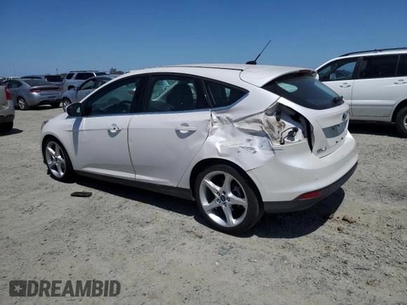 2014 Ford Focus Titanium with VIN 1FADP3N2XEL423320, listed as a Copart auction lot 58709875 with 93,011 mi miles and Salvage title. Bid and sale history available at DreamBid. Image 2.