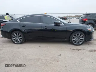 2020 Mazda 6 Grand Touring with VIN JM1GL1TY5L1513949, listed as a IAAI auction lot 40953540 with 55,616 mi miles and . Bid and sale history available at DreamBid. Image 13.