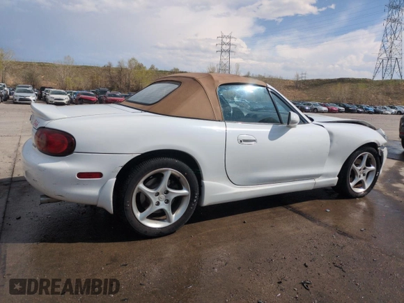 2002 Mazda MX-5 Miata Cloth z VIN JM1NB353X20229549, wystawiony jako Copart lot #54549205 z przebiegiem 79 871 mil mil oraz Szkoda całkowita • Salvage title. Historia ofert i sprzedaży dostępna na DreamBid. Obrazek 3.