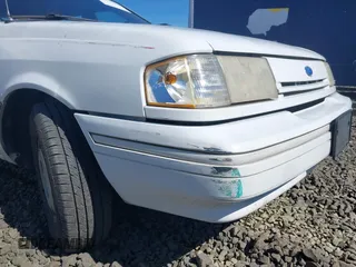 1993 Ford Tempo z VIN 1FAPP36X7PK153107, wystawiony jako IAAI lot #41867198 z przebiegiem 9377 mil mil oraz . Historia ofert i sprzedaży dostępna na DreamBid. Obrazek 6.