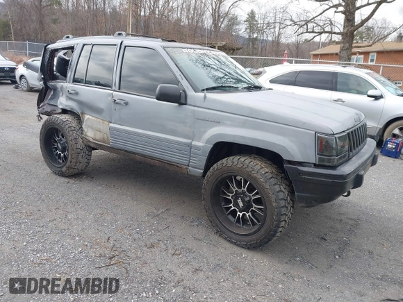 1995 Jeep Grand Cherokee Laredo with VIN 1J4GZ58S4SC778322, listed as a IAAI auction lot 41498800 with 255,058 mi miles. Bid and sale history available at carsss.com. Image 1.