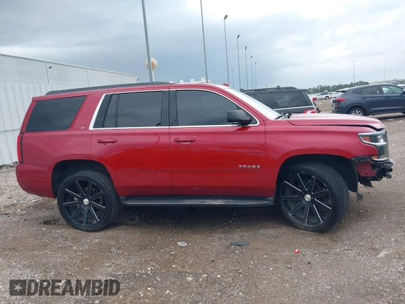 2015 Chevrolet Tahoe LT with VIN 1GNSCBKC1FR721605, listed as a IAAI auction lot 42184896 with 200,983 mi miles and . Bid and sale history available at DreamBid. Image 14.