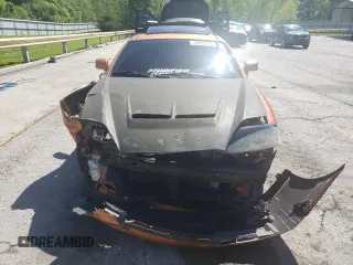 2006 Hyundai Tiburon GT z VIN KMHHN65F66U191134, wystawiony jako Copart lot #56692615 z przebiegiem 197 093 mil mil oraz Szkoda całkowita • Salvage title. Historia ofert i sprzedaży dostępna na DreamBid. Obrazek 5.