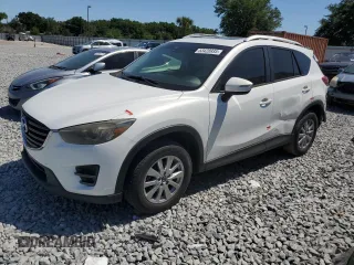 2016 Mazda CX-5 Touring z VIN JM3KE4CY2G0689964, wystawiony jako Copart lot #53428935 z przebiegiem 160 445 mil mil oraz Szkoda całkowita • Salvage title. Historia ofert i sprzedaży dostępna na DreamBid. Obrazek 1.