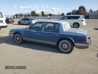 1988 Cadillac Seville z VIN 1G6KS5152JU809989, wystawiony jako Copart lot #51385205 z przebiegiem 40 217 mil mil oraz Czysty tytuł • Clean title. Historia ofert i sprzedaży dostępna na DreamBid. Obrazek 2.