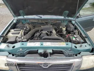 1999 Mazda B-Series Truck SX z VIN 4F4YR12CXXTM22296, wystawiony jako Copart lot #57175325 z przebiegiem 129 333 mil mil oraz Szkody całkowita. Historia ofert i sprzedaży dostępna na DreamBid. Obrazek 11.