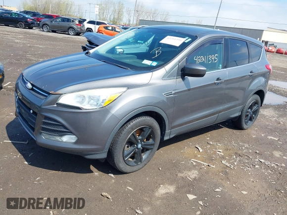 2013 Ford Escape SE with VIN 1FMCU9GX0DUA52263, listed as a IAAI auction lot 42211395 with 140,067 mi miles and . Bid and sale history available at DreamBid. Image 2.