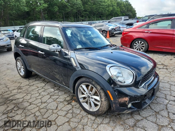 2014 MINI Countryman S with VIN WMWZC3C56EWP25479, listed as a Copart auction lot 61197525 with 101,146 mi miles and Salvage title. Bid and sale history available at DreamBid. Image 4.