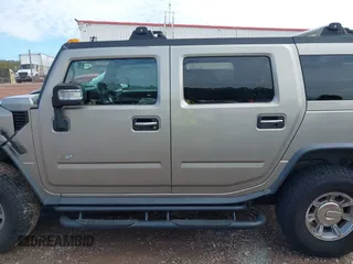 2005 Hummer H2 SUV with VIN 5GRGN23U65H101545, listed as a IAAI auction lot 41426274 with 293,821 mi miles. Bid and sale history available at carsss.com. Image 14.