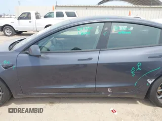2023 Tesla Model 3 with VIN 5YJ3E1EA5PF565071, listed as a IAAI auction lot 42232719 with 15,389 mi miles and . Bid and sale history available at DreamBid. Image 15.