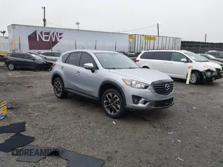 2016 Mazda CX-5 Grand Touring with VIN JM3KE4DY4G0712465, listed as a IAAI auction lot 41859217 with 61,806 mi miles and . Bid and sale history available at carsss.com. Image 1.