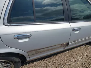 2002 Mercury Grand Marquis GS z VIN 2MEFM74W92X607734, wystawiony jako IAAI lot #42413400 z przebiegiem 209 565 mil mil oraz . Historia ofert i sprzedaży dostępna na DreamBid. Obrazek 6.
