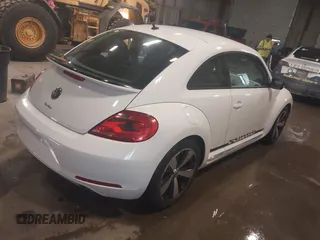 2012 Volkswagen Beetle 2.0T Turbo PZEV with VIN 3VWVA7AT4CM603293, listed as a IAAI auction lot 41633664 with 91,410 mi miles. Bid and sale history available at carsss.com. Image 4.