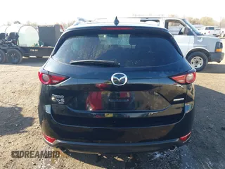 2020 Mazda CX-5 Grand Touring with VIN JM3KFBDM0L0790508, listed as a IAAI auction lot 41883319 with 114,398 mi miles and . Bid and sale history available at carsss.com. Image 16.