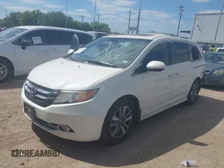 2016 Honda Odyssey Touring Elite with VIN 5FNRL5H98GB102544, listed as a IAAI auction lot 42040050 with 128,957 mi miles and . Bid and sale history available at DreamBid. Image 2.