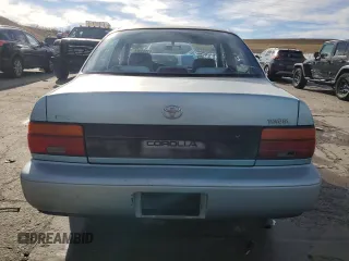 1994 Toyota Corolla Deluxe with VIN JT2AE09B4R0067104, listed as a Copart auction lot 83565064 with 207,923 mi miles and Salvage title. Bid and sale history available at DreamBid. Image 6.