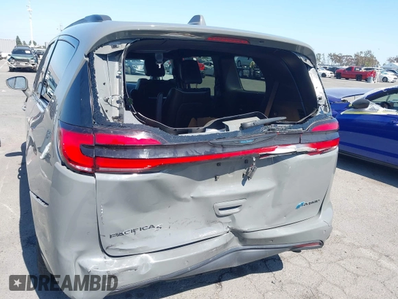 2021 Chrysler Pacifica Hybrid Limited z VIN 2C4RC1S76MR544495, wystawiony jako IAAI lot #42294312 z przebiegiem 89 083 mil mil oraz . Historia ofert i sprzedaży dostępna na DreamBid. Obrazek 6.