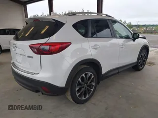 2016 Mazda CX-5 Grand Touring with VIN JM3KE2DYXG0675619, listed as a IAAI auction lot 42137144 with 106,262 mi miles and . Bid and sale history available at DreamBid. Image 4.