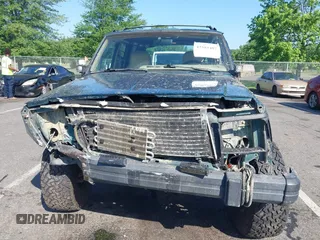 1995 Jeep Cherokee Sport z VIN 1J4FJ68S7SL623451, wystawiony jako IAAI lot #42581407 z przebiegiem 160 581 mil mil oraz . Historia ofert i sprzedaży dostępna na DreamBid. Obrazek 6.