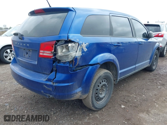 2015 Dodge Journey SE z VIN 3C4PDCAB8FT552555, wystawiony jako IAAI lot #42195398 z przebiegiem 149 503 mil mil oraz . Historia ofert i sprzedaży dostępna na DreamBid. Obrazek 4.