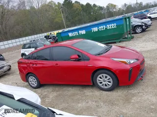 2021 Toyota Prius L Eco with VIN JTDKAMFU6M3134586, listed as a IAAI auction lot 41909538 with 55,355 mi miles. Bid and sale history available at carsss.com. Image 13.
