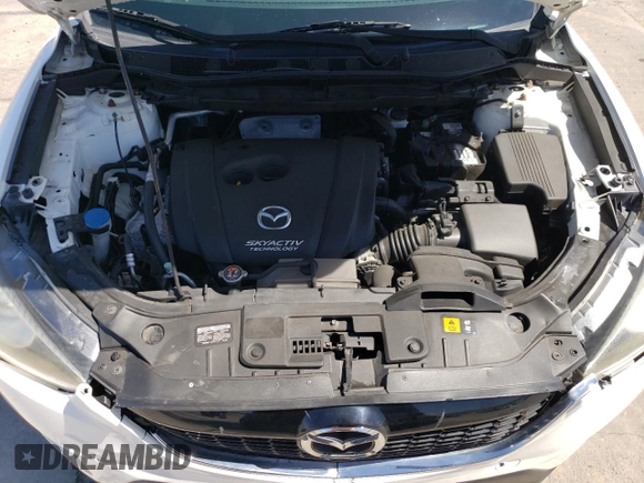2014 Mazda CX-5 Touring z VIN JM3KE4CYXE0393443, wystawiony jako Copart lot #54738705 z przebiegiem 68 220 mil mil oraz Szkody całkowita. Historia ofert i sprzedaży dostępna na DreamBid. Obrazek 12.
