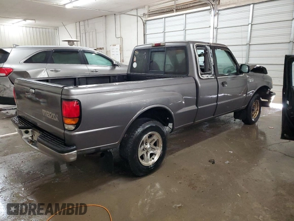 2000 Mazda B-Series 2WD Truck SE with VIN 4F4YR16V8YTM12086, listed as a Copart auction lot 82609244 with 297,354 mi miles and Salvage Title. Bid and sale history available at carsss.com. Image 3.