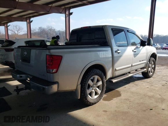 2011 Nissan Titan SL with VIN 1N6AA0EC7BN306488, listed as a IAAI auction lot 41413618 with 102,465 mi miles. Bid and sale history available at carsss.com. Image 4.