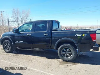 2014 Nissan Titan S with VIN 1N6AA0EC6EN506928, listed as a IAAI auction lot 41380319 with 102,669 mi miles and . Bid and sale history available at DreamBid. Image 14.