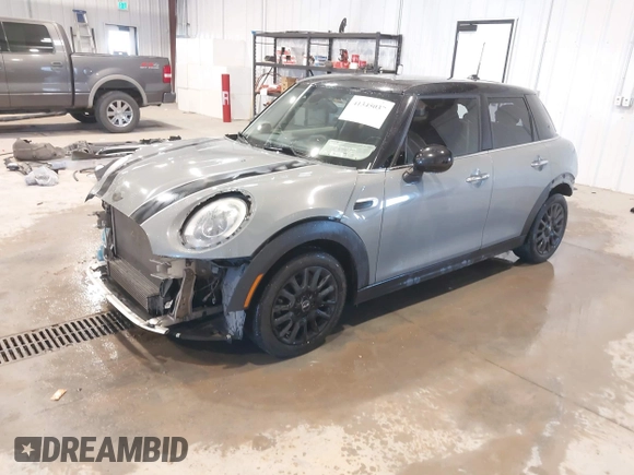 2015 MINI Hardtop 4 Door with VIN WMWXS5C58FT830081, listed as a IAAI auction lot 41345037 with 93,545 mi miles and . Bid and sale history available at DreamBid. Image 2.
