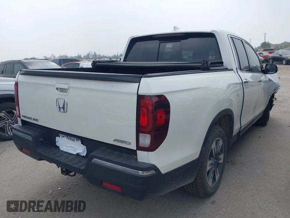 2018 Honda Ridgeline RTL-E with VIN 5FPYK3F77JB004379, listed as a IAAI auction lot 41802025 with 132,085 mi miles and . Bid and sale history available at DreamBid. Image 4.