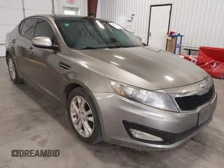 2013 Kia Optima EX z VIN 5XXGN4A70DG128472, wystawiony jako IAAI lot #42805099 z przebiegiem 200 501 mil mil oraz . Historia ofert i sprzedaży dostępna na DreamBid. Obrazek 1.