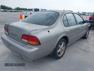 1999 Nissan Maxima GXE with VIN JN1CA21D6XT223369, listed as a IAAI auction lot 42141361 with 210,781 mi miles and . Bid and sale history available at DreamBid. Image 4.