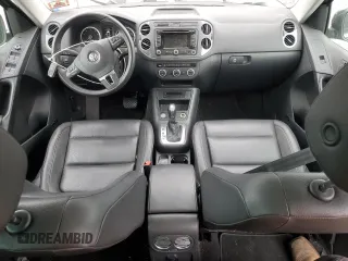 2014 Volkswagen Tiguan S z VIN WVGBV3AX5EW554500, wystawiony jako Copart lot #57016775 z przebiegiem 91 101 mil mil oraz Szkoda całkowita • Salvage title. Historia ofert i sprzedaży dostępna na DreamBid. Obrazek 8.