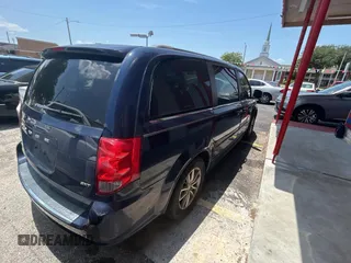 2014 Dodge Grand Caravan SXT with VIN 2C4RDGCG1ER308403, listed as a Copart auction lot 56712885 with 131,847 mi miles and Clean Title. Bid and sale history available at DreamBid. Image 4.