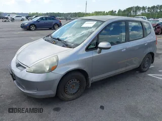2008 Honda Fit with VIN JHMGD38438S030619, listed as a IAAI auction lot 42010052 with 147,588 mi miles. Bid and sale history available at carsss.com. Image 2.